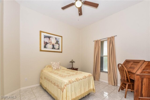 tiled bedroom featuring ceiling fan