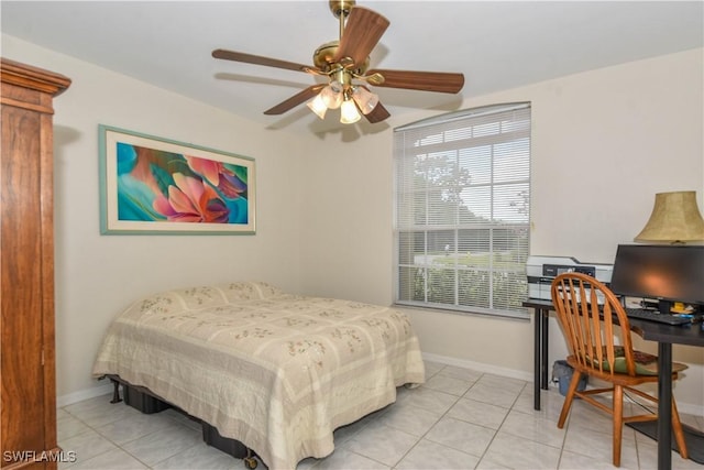 bedroom featuring light tile patterned flooring and ceiling fan