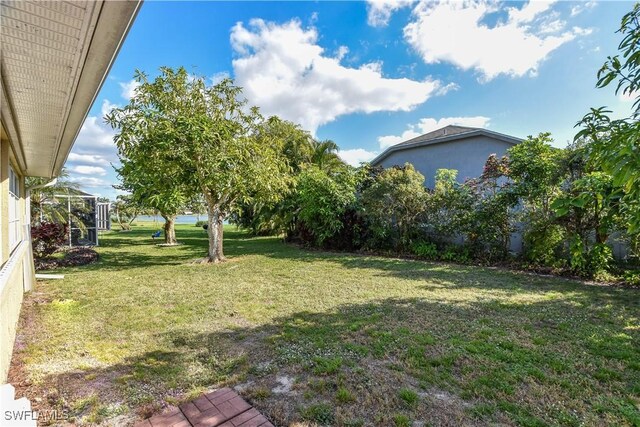 view of yard with a lanai