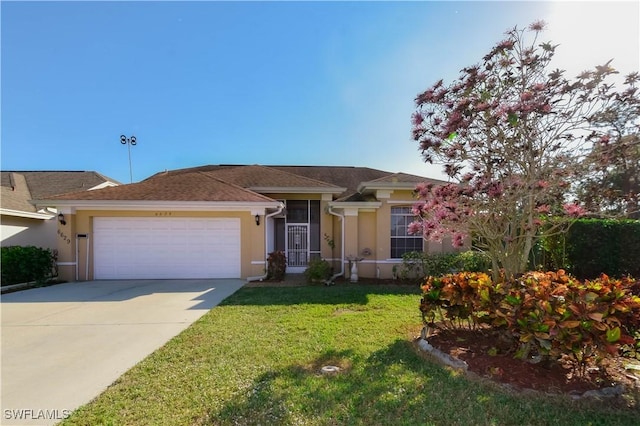 view of front facade with a garage and a front lawn