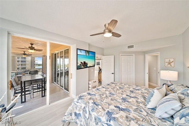 bedroom featuring access to exterior, a closet, ceiling fan, and light wood-type flooring