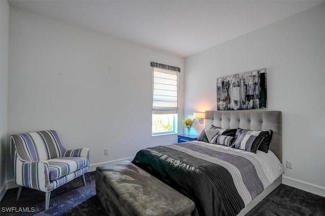 bedroom featuring baseboards and carpet floors