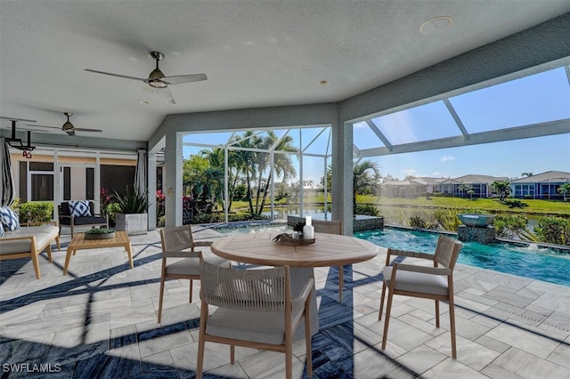 sunroom featuring a healthy amount of sunlight and a pool