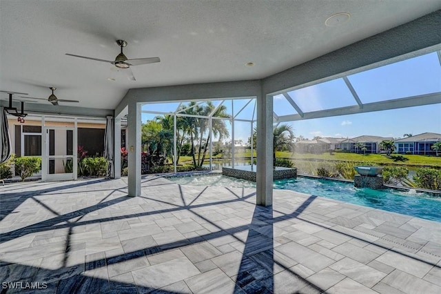 view of pool with a lanai, a ceiling fan, and a patio area