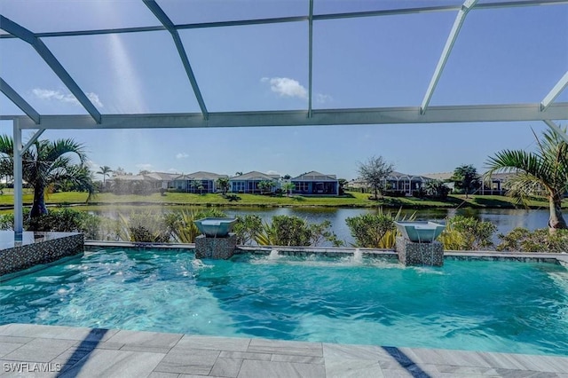 outdoor pool with a residential view, glass enclosure, and a water view