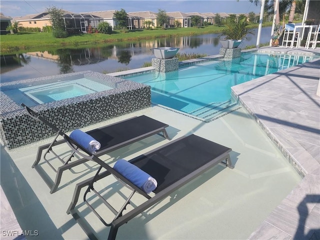 pool with a residential view, a water view, and an in ground hot tub