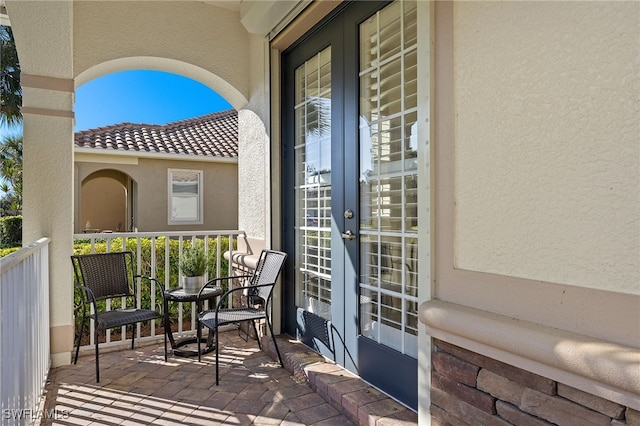 balcony featuring french doors