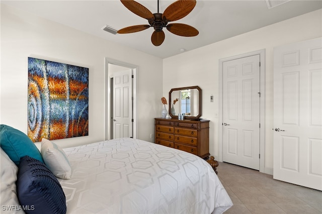 tiled bedroom with ceiling fan