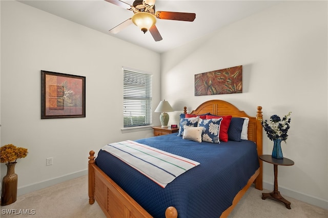 bedroom with ceiling fan and light colored carpet