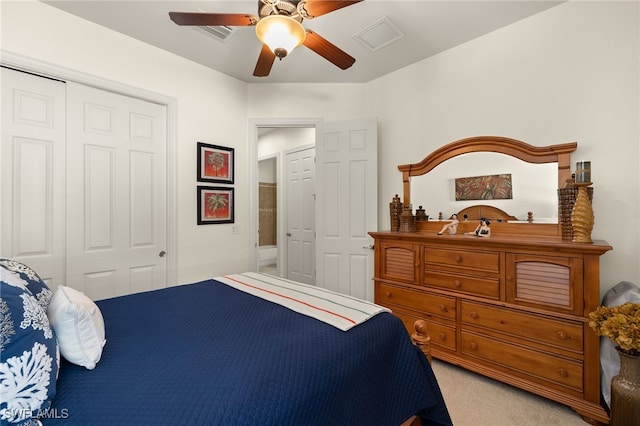 carpeted bedroom with a closet and ceiling fan