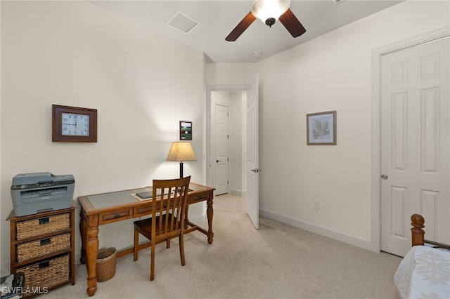 carpeted office with ceiling fan