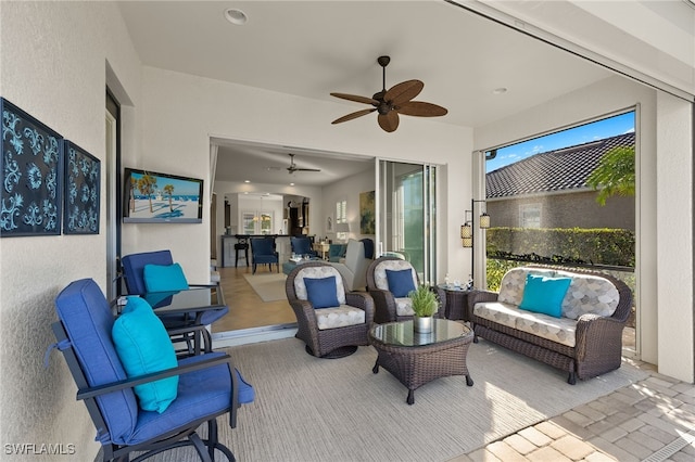 view of patio with an outdoor hangout area and ceiling fan