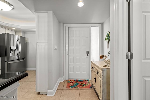 foyer featuring light tile patterned floors