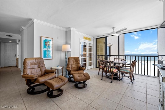 interior space with ceiling fan and a water view