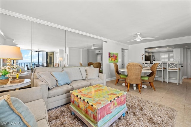 tiled living room featuring crown molding and ceiling fan