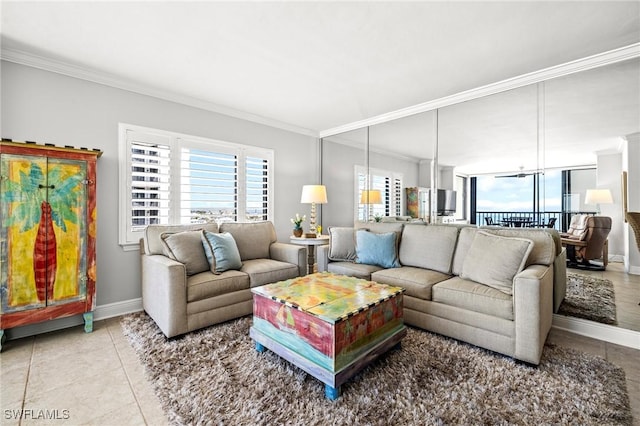 tiled living room with crown molding and a healthy amount of sunlight