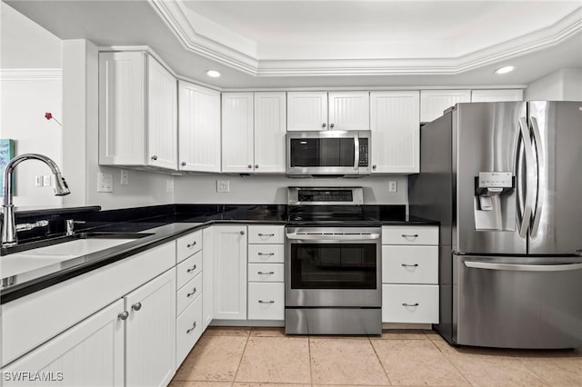 kitchen with white cabinetry, sink, light tile patterned floors, and appliances with stainless steel finishes