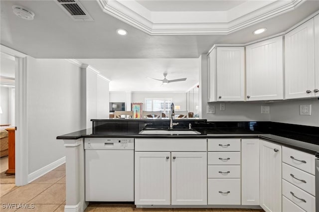 kitchen with sink, white cabinetry, white dishwasher, kitchen peninsula, and ceiling fan