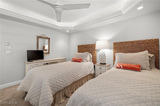 bedroom with crown molding, light colored carpet, a raised ceiling, and ceiling fan