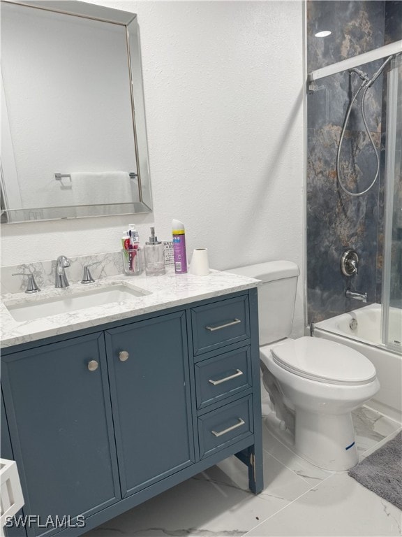 full bathroom featuring toilet, vanity, and combined bath / shower with glass door