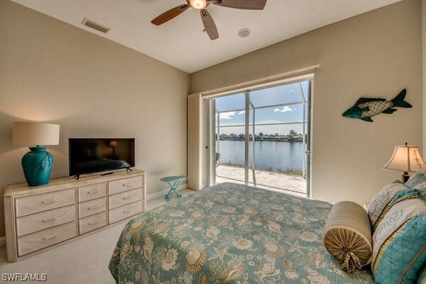 carpeted bedroom with lofted ceiling, access to outside, and ceiling fan