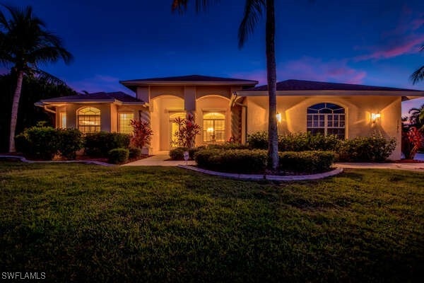 view of front of home with a yard