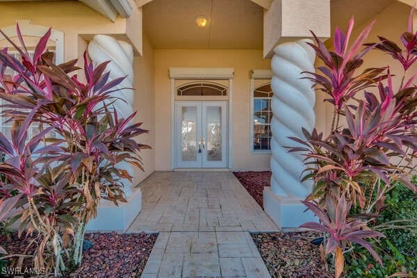 doorway to property featuring french doors