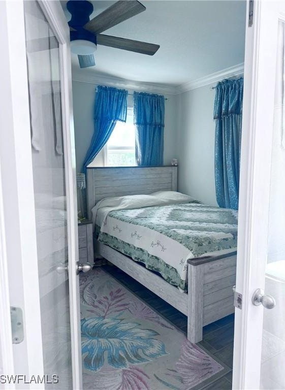 bedroom with crown molding and ceiling fan