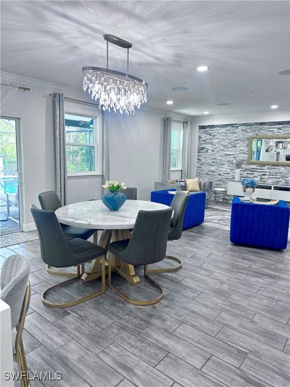 dining space featuring ornamental molding and a healthy amount of sunlight