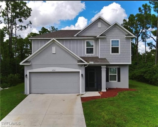 craftsman-style home featuring a garage and a front lawn