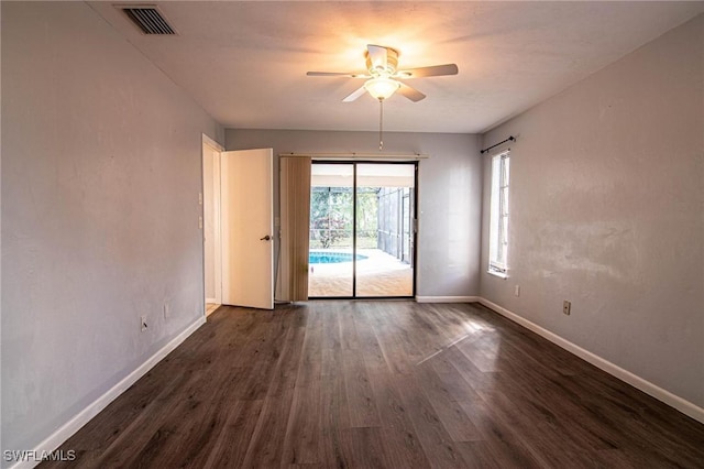 unfurnished room with dark wood-type flooring and ceiling fan