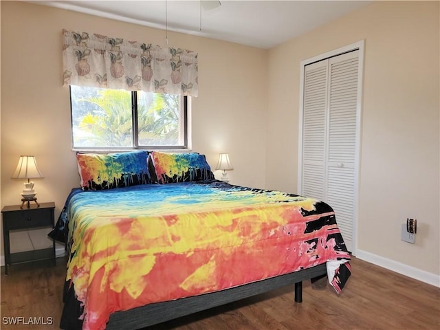 401 SE 8th Ter, Cape Coral, FL 33990 - bedroom featuring wood finished floors, a closet, and baseboards