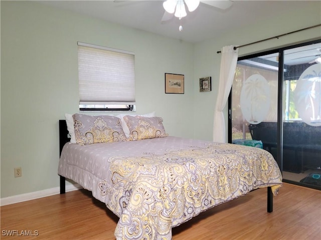 401 SE 8th Ter, Cape Coral, FL 33990 - bedroom with wood finished floors, access to outside, baseboards, and ceiling fan