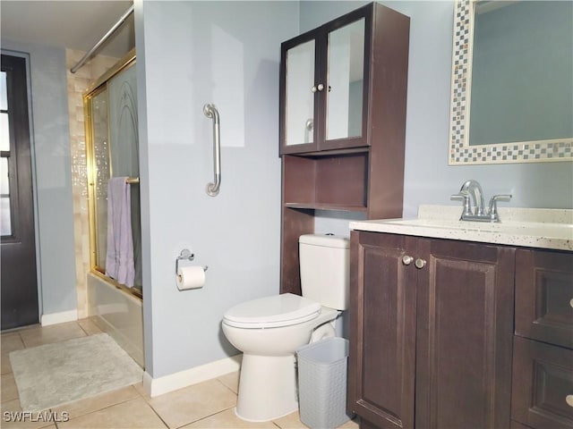 401 SE 8th Ter, Cape Coral, FL 33990 - full bathroom with tile patterned flooring, vanity, bath / shower combo with glass door, toilet, and baseboards