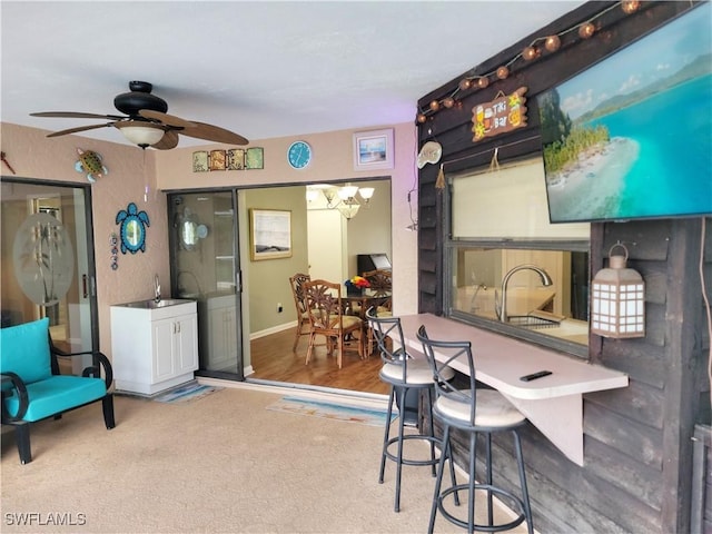 401 SE 8th Ter, Cape Coral, FL 33990 - office space with a ceiling fan, a sink, baseboards, and a chandelier