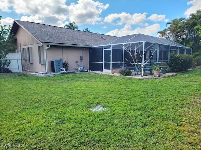 401 SE 8th Ter, Cape Coral, FL 33990 - rear view of property with roof with shingles and glass enclosure