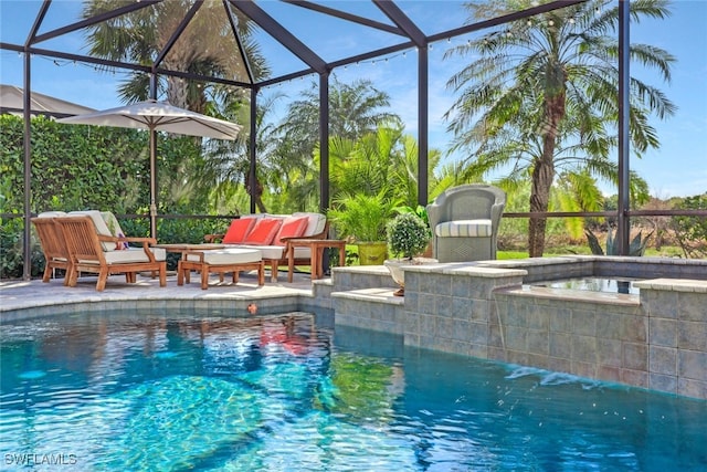 view of pool with a patio, a hot tub, outdoor lounge area, and glass enclosure