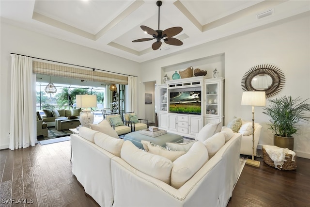 living room with coffered ceiling, ceiling fan, dark wood-type flooring, and beamed ceiling