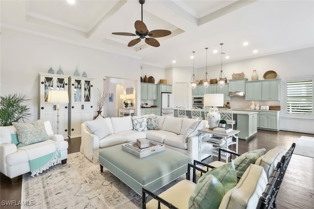 living room featuring hardwood / wood-style flooring, crown molding, ceiling fan, coffered ceiling, and beamed ceiling