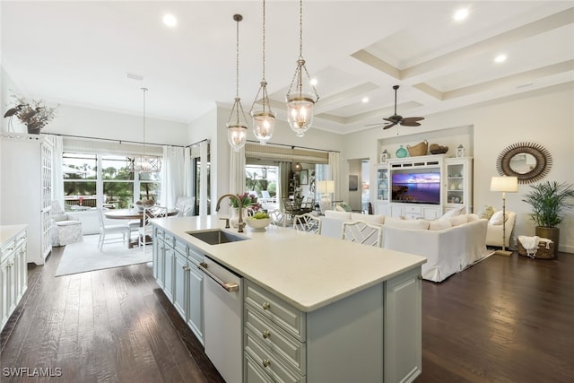 kitchen featuring dark wood-type flooring, coffered ceiling, sink, a center island with sink, and white dishwasher