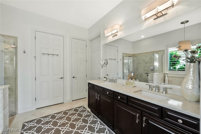 bathroom featuring tile patterned floors, vanity, and an enclosed shower