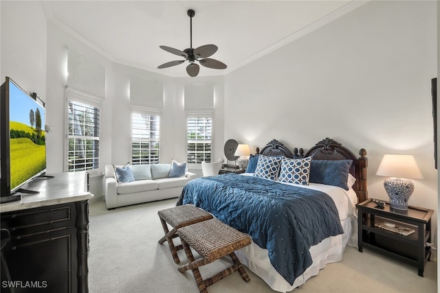 bedroom with ornamental molding, light carpet, and ceiling fan