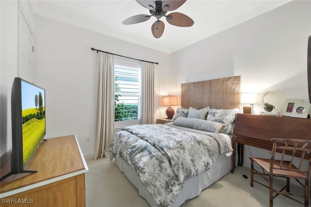 carpeted bedroom featuring crown molding and ceiling fan