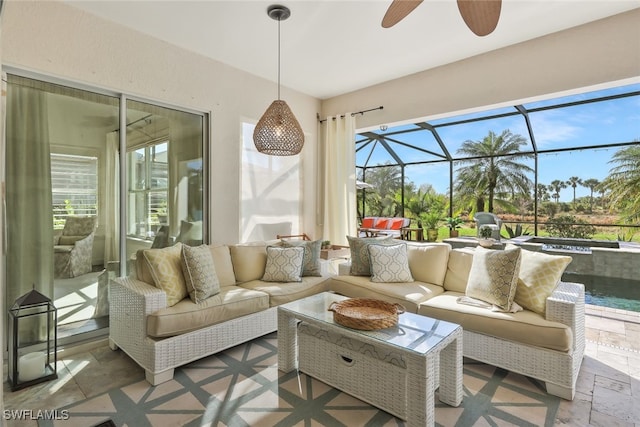 sunroom / solarium featuring ceiling fan