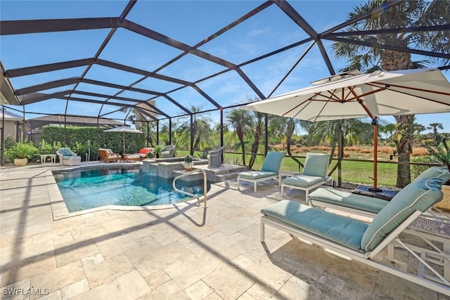 view of swimming pool featuring an in ground hot tub, a patio, and glass enclosure