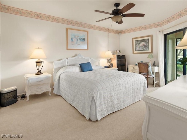 carpeted bedroom with ceiling fan