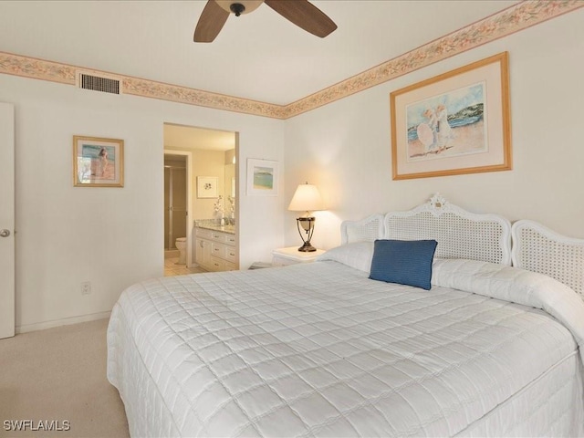 carpeted bedroom with ensuite bathroom