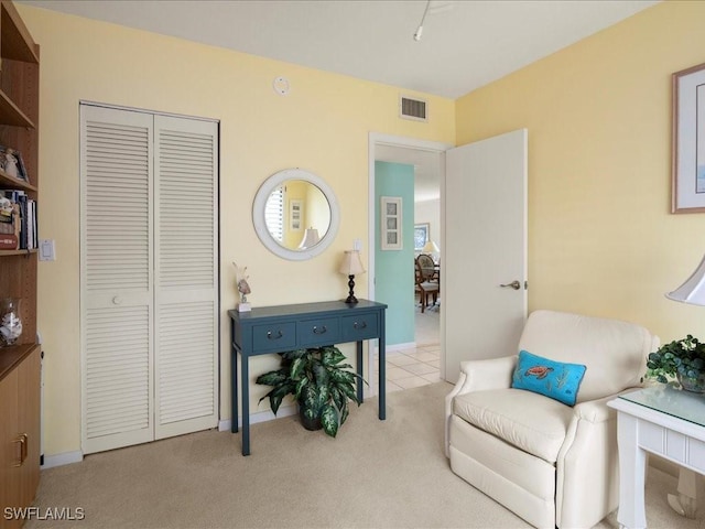 living area with light colored carpet