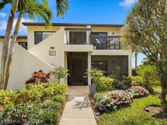 view of front of house with a balcony