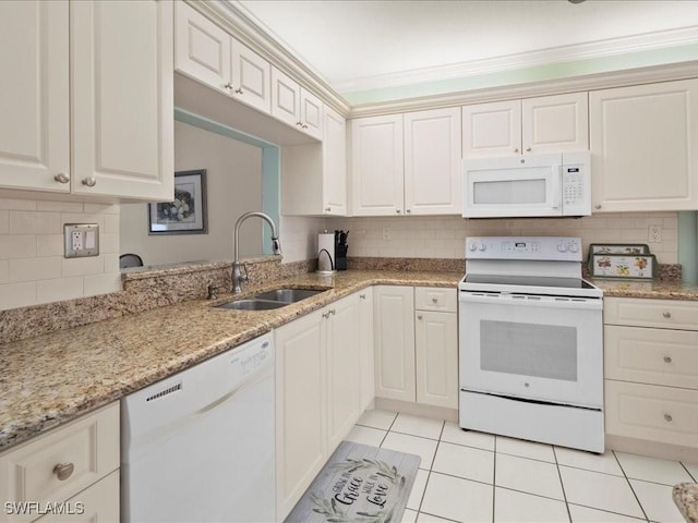 kitchen featuring sink, crown molding, white appliances, light tile patterned floors, and backsplash